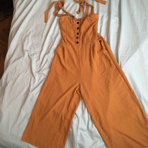 2 jumpsuits and a skirt